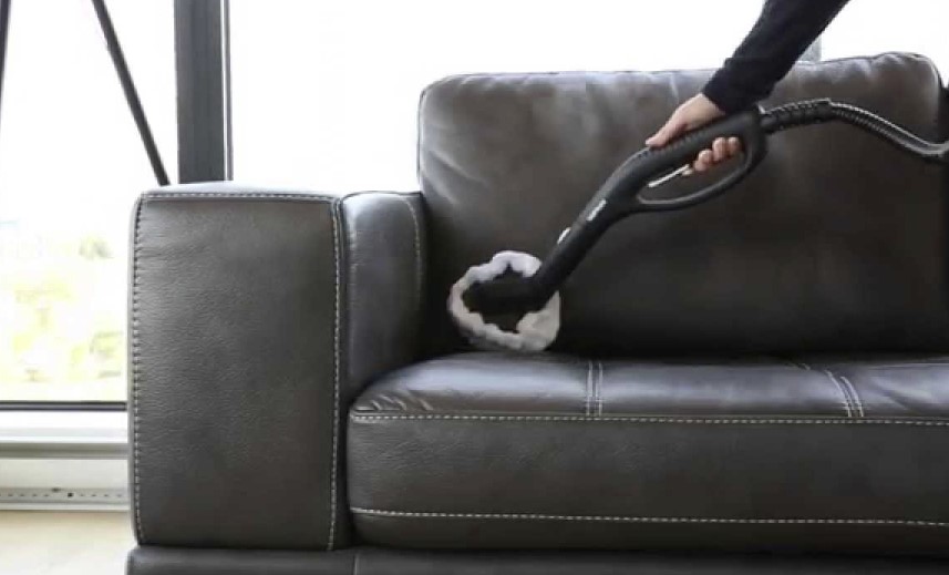 Vacuuming a leather couch
