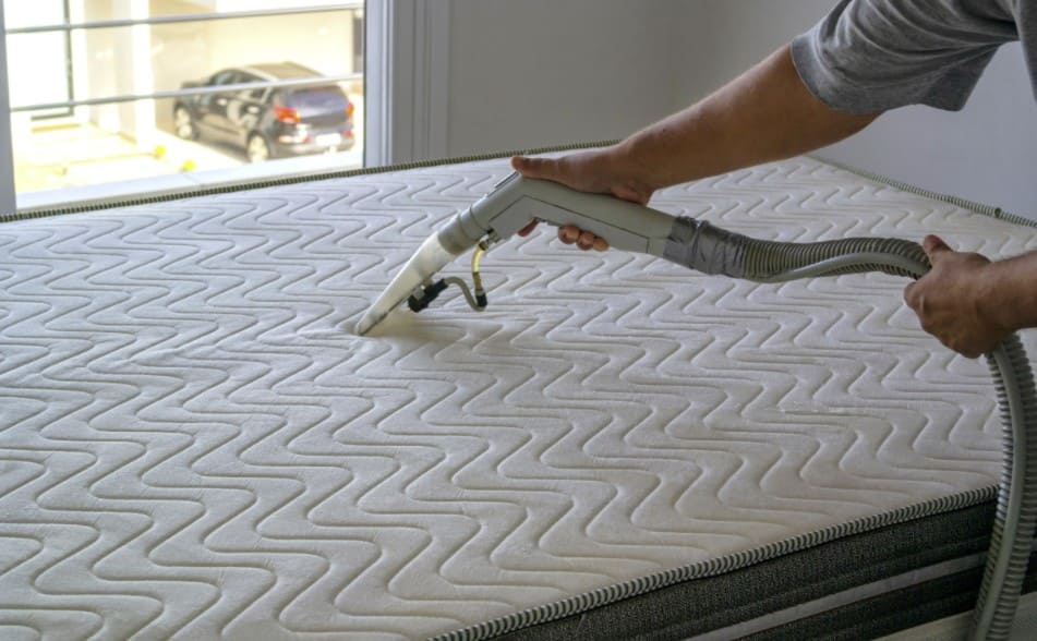 vacuuming a mattress