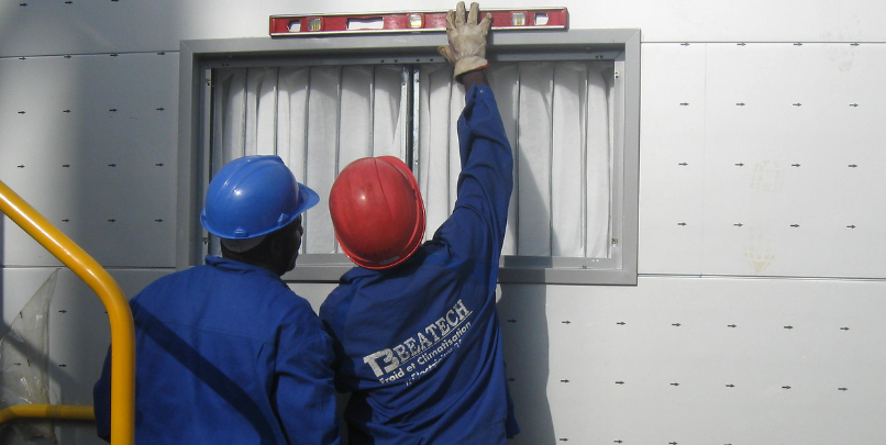 Builders working on a window